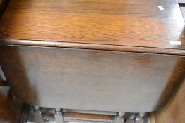 An early 20th Century oak gateleg table, width approx. 68cm