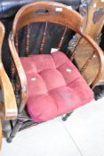 A Victorian spindle back armchair having turned frame