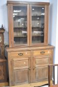 A late Victorian or Edwardian light mahogany bookcase having cupboard under, width approx. 107cm