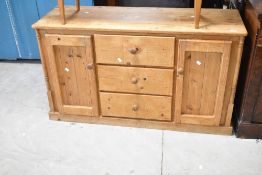 A traditional pine kitchen dresser base, width approx. 130cm