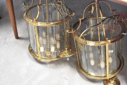 A set of six large brass and glass ceiling light fittings, diameter 39cm