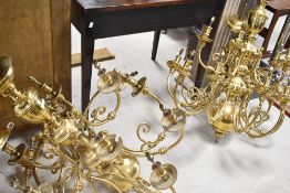 A pair of large brass multi branch light fittings