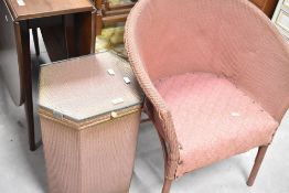 A vintage woven fibre tub chair and linen basket, not lloyd loom