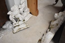 A pair of painted cast iron door stops, modelled as rampant lions and a similar larger lion
