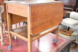 A vintage oak and ply tea trolley