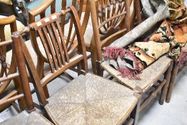A set of three 19th Century rush seated chairs having turned spindle backs, plus one similar rail
