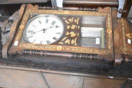 A 19th century mahogany and inlaid American style wall clock