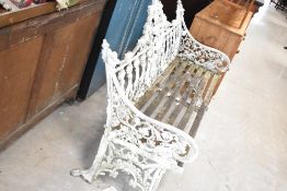 A traditional cast alloy garden bench having slatted wooden seat, bears Coalbrookdale and lozenge