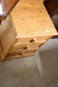 A natural pine three drawer bedside chest, width approx. 46cm