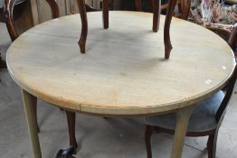 A vintage teak McIntosh circular extending dining table , having later limed oak effect painting ,