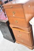 A pair of modern laminate mahogany effect bedside chests