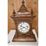 An early 20th Century mahogany cased mantel clock having enamelled Roman numeral dial