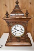An early 20th Century mahogany cased mantel clock having enamelled Roman numeral dial