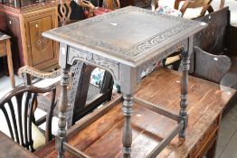 A late 19th or early 20th Century occasional table having carved top and turned legs, width