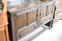 An early 20th Century oak ledge back sideboard, width approx. 152cm