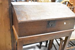 A 19th Century oak clerks desk, width approx. 75cm