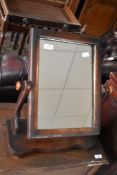 A Victorian toilet mirror on shaped base, width approx. 39cm