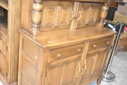 An Ercol court cupboard