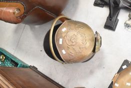A 19th Century brass coal helmet