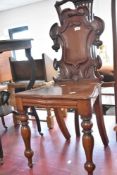 A Victorian mahogany hall chair having shield back
