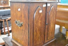 A Victorian Gothic oak storage cabinet of small proportions, with internal drawers, dimensions
