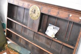 A period oak dresser back having brass clock dial to centre , named for Robinson, Brandon, width