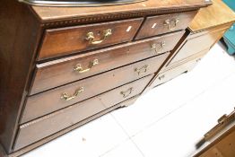 A 19th Century oak chest of two over three drawers, having brass drop handles and bracket feet,