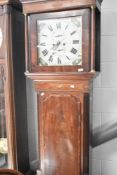 A 19th Century mahogany long case clock having eight day movement having painted Roman numeral