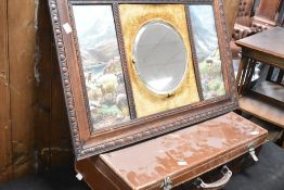 An early 20th Century oak framed wall mirror having pictorial highland print and velvet back