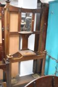 An early 20th Century oak hall stand, having Arts and Crafts style coat hooks, height approx. 200cm,