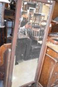 A vintage stained frame cheval mirror