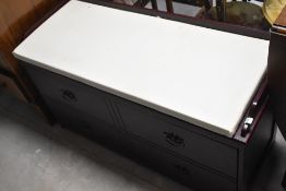 A modern mahogany effect shoe cabinet with seat over, width approx.99cm