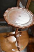 A reproduction occasional wine table