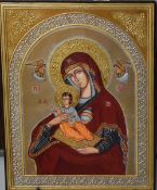 Two modern Romanian hand-decorated wooden panel religious icons, the larger depicting the virgin