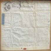 An 18th century framed indenture, written December 16th 1736, later mounted and framed, under