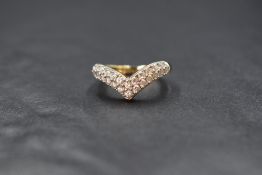 A 14ct gold cubic zirconia wishbone ring by QVC having a double row of stones on a 14ct gold loop,