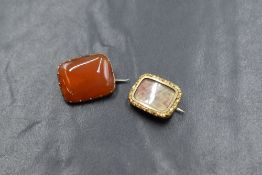 A yellow metal presumed gold mourning brooch, the rectangular brooch having a decorative border with