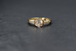 A 14ct gold cubic zirconia ring by QVC having a central stone in a 4 claw raised mount within gem