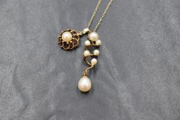A 9ct gold cultured pearl pendant having a decorative looped mount, and another multi pearl set