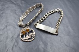 Three pieces of silver jewellery including a brooch, gate bar bracelet and identity bracelet with
