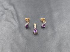 A pair of 9ct gold diamond and amethyst stud earrings having a small diamond in a collared mount