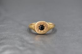 A 9ct gold sapphire set signet ring, the central round cut sapphire measuring approximately 0.48ct