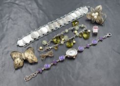 A small selection of white metal jewellery, some stamped 925, including filligree brooches, charm,