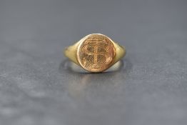 A gent's 18ct gold signet ring of plain form bearing monogram TS, size Q & approx 6.4g