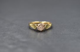 An 18ct gold diamond set solitaire, the illusion set round brilliant cut diamond measuring