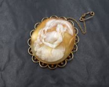 A large 15ct gold mounted cameo brooch, the shell cameo depicting Hebe goddess of youth feeding