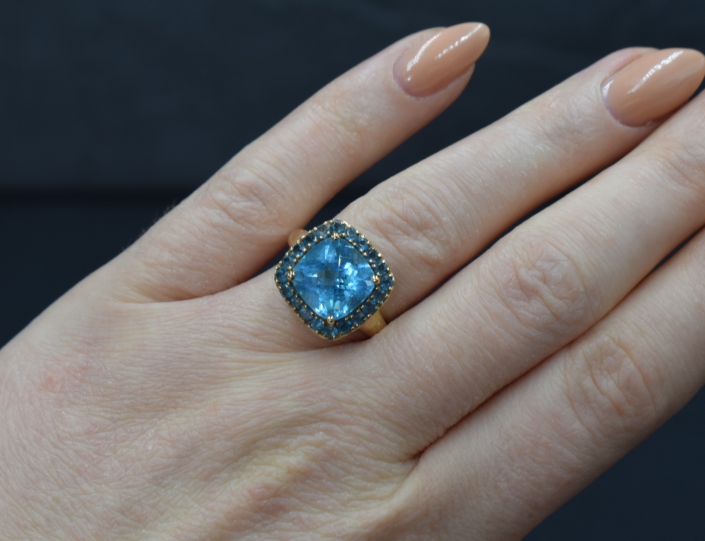 A 9ct gold blue topaz ring by QVC, the central cushion cut blue topaz within a halo surround of - Image 3 of 3