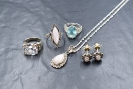 A set of silver jewellery comprising pendant, earrings and ring, all having marcasite and mother