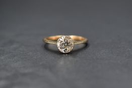 An 18ct gold diamond solitaire ring, the old cut diamond being approx 1.25ct in a collared mount