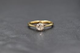 A yellow metal diamond solitaire ring having an old cut diamond of approx 0.75ct in a claw set mount